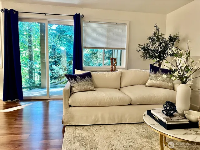 a living room with furniture and a large window
