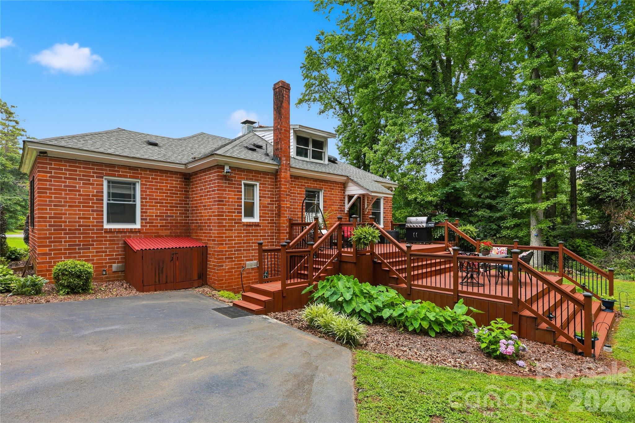 106 Maple Street Fort Mill, SC 29715 - Photo 41 of 44 a front view of a house with a garden