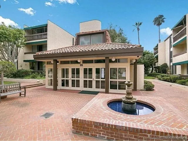 a front view of a house with parking space