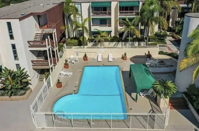 a kitchen with a sink stove and refrigerator