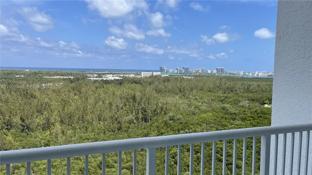 a view of a green field with an outdoor space