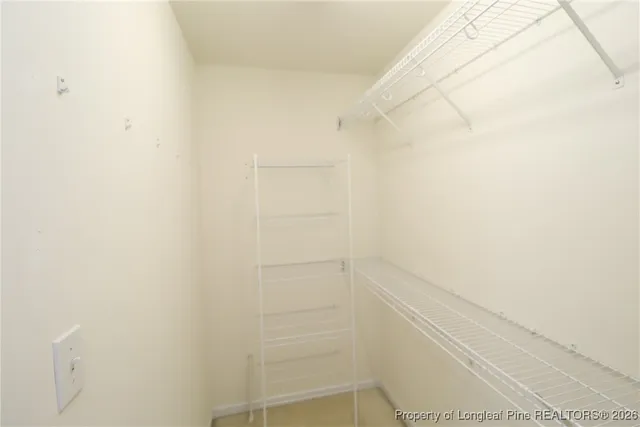 a bathroom with a granite countertop sink mirror and a bathtub