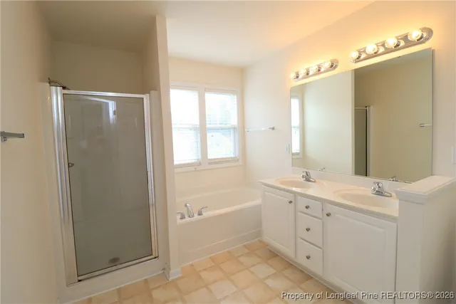 a bathroom with a bathtub and a sink