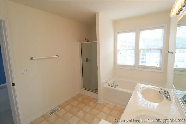a bathroom with a sink a toilet and a tub