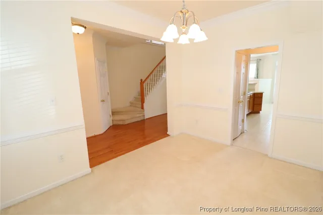 a kitchen with a refrigerator and cabinets