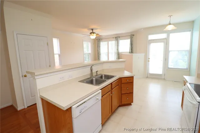 a kitchen with stainless steel appliances a refrigerator and a stove