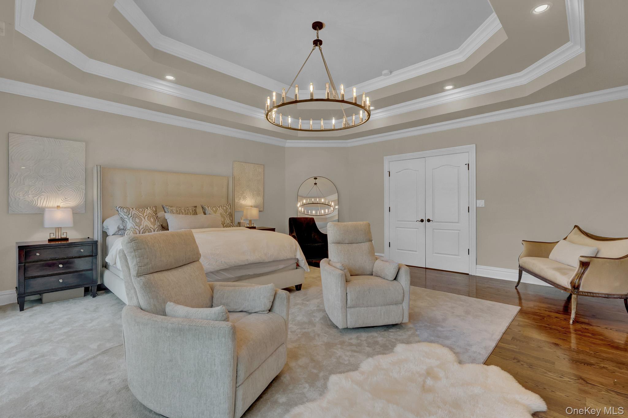 36 Old Field Road Setauket, NY 11733 - Photo 31 of 42 a living room with furniture and a chandelier