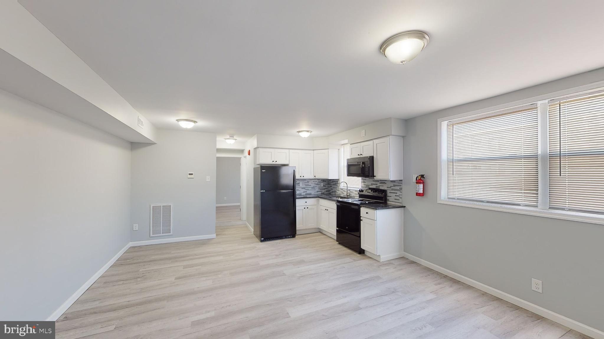 910 Gateway Boulevard, Unit A6 Westville, NJ 08093 - Photo 11 of 12 a view of a kitchen with a sink a refrigerator and window