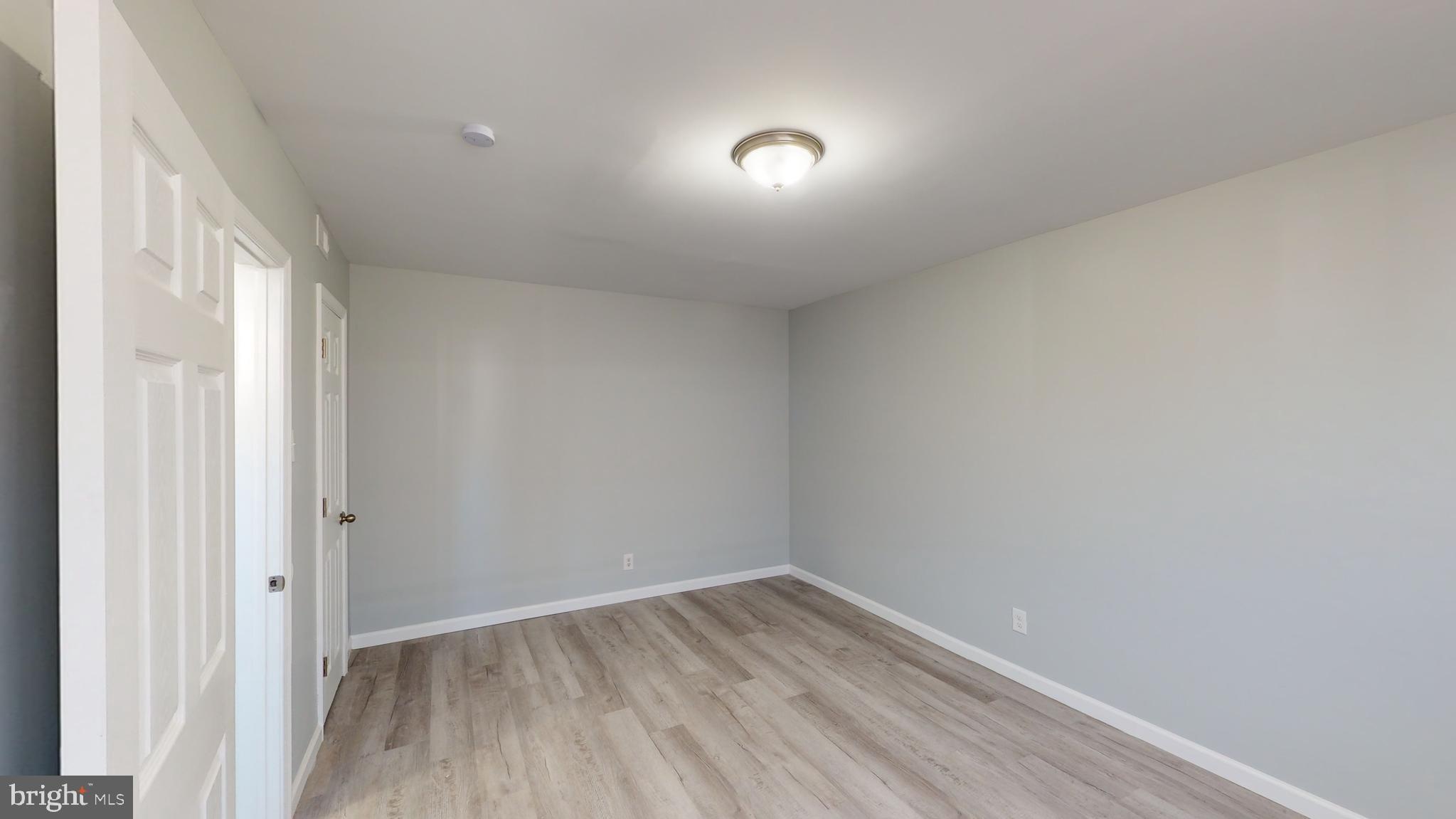 910 Gateway Boulevard, Unit A6 Westville, NJ 08093 - Photo 8 of 12 a view of empty room with wooden floor