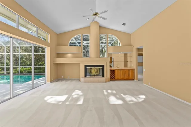 a kitchen with stainless steel appliances granite countertop a sink and a refrigerator