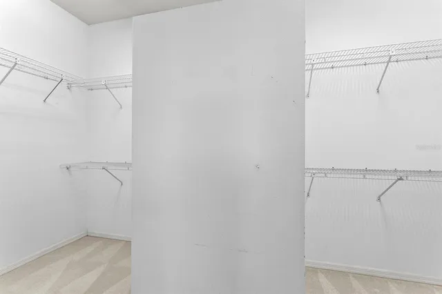 a bathroom with a toilet a sink a mirror and a shower