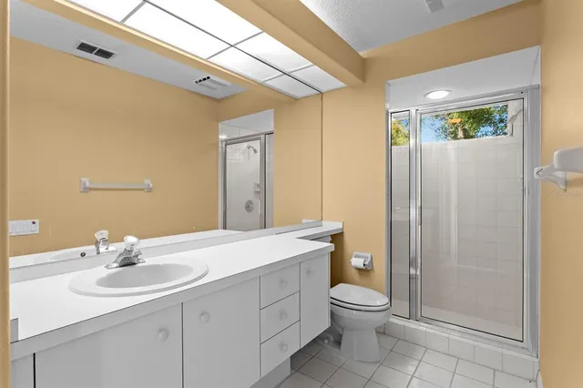 a view of a backyard with a wooden fence