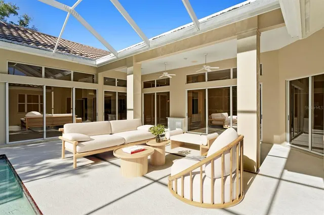a view of a patio with a table chairs and a table