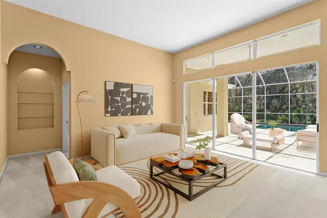 a view of a dining room with furniture and chandelier