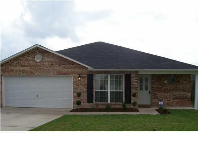 293 Limestone Circle Crestview, FL 32539 - Photo 1 of 20 a black and white building with a yard