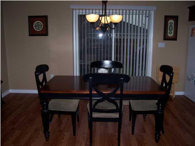 293 Limestone Circle Crestview, FL 32539 - Photo 10 of 20 a view of a room with furniture and wooden floor