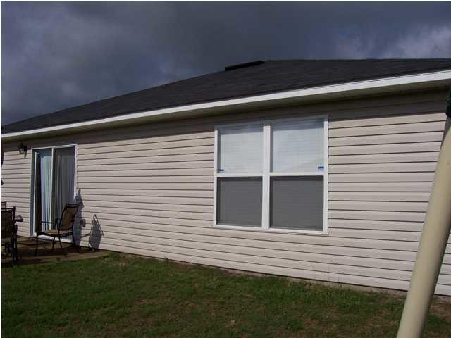 293 Limestone Circle Crestview, FL 32539 - Photo 12 of 20 a view of a house with a yard