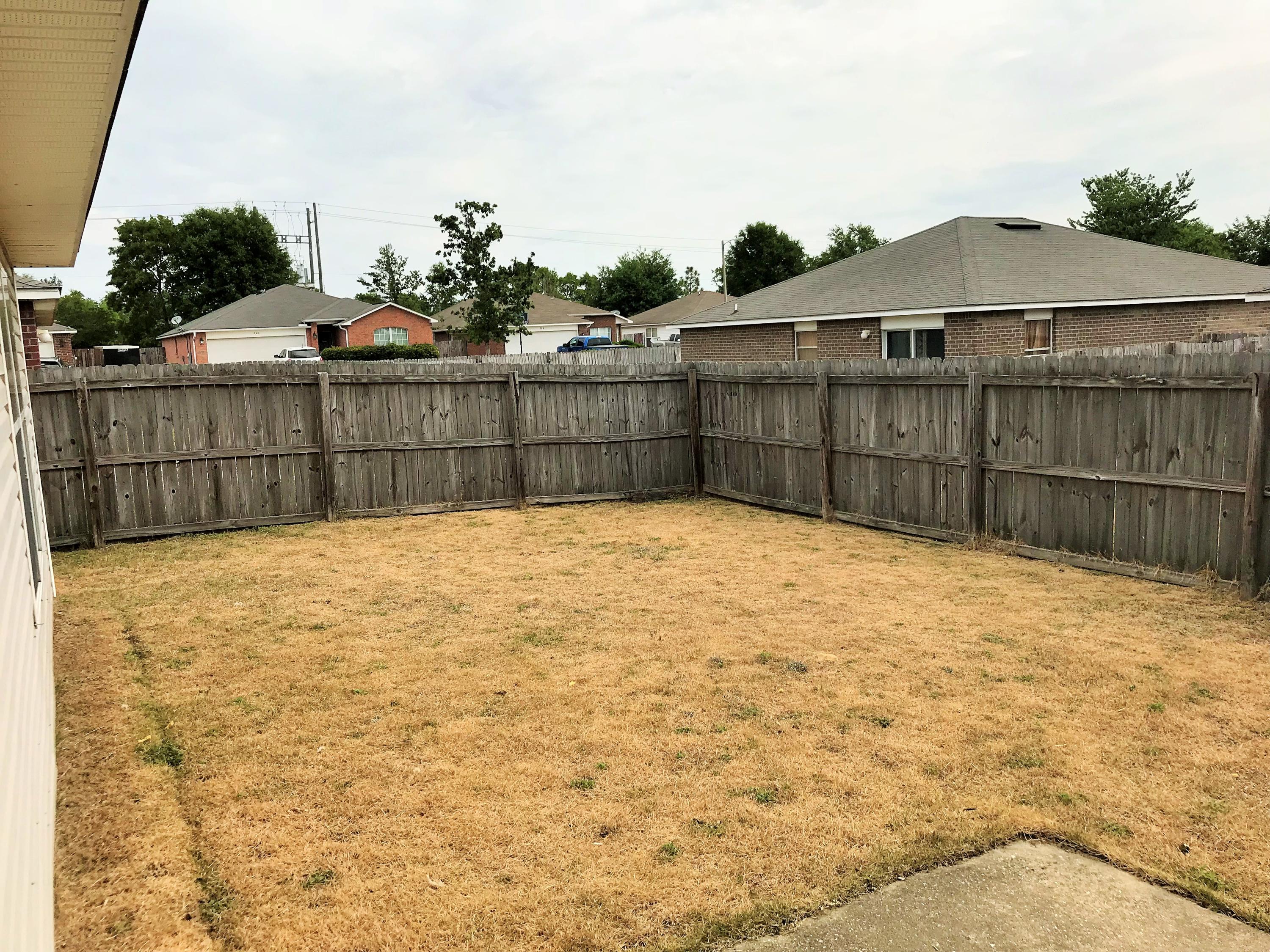 293 Limestone Circle Crestview, FL 32539 - Photo 18 of 20 a view of a backyard