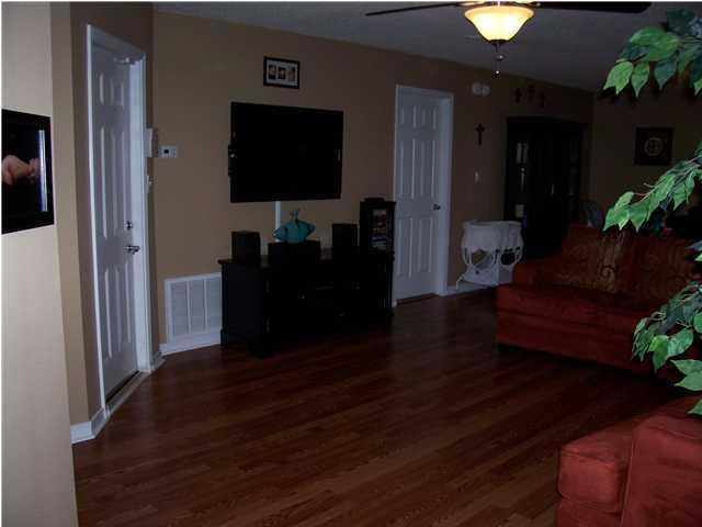 293 Limestone Circle Crestview, FL 32539 - Photo 9 of 20 a living room with furniture and a flat screen tv