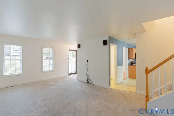a view of livingroom with hardwood floor and windows
