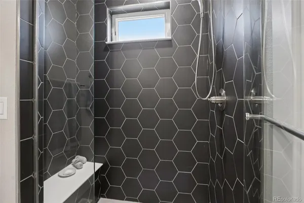 a bathroom with a sink and a shower