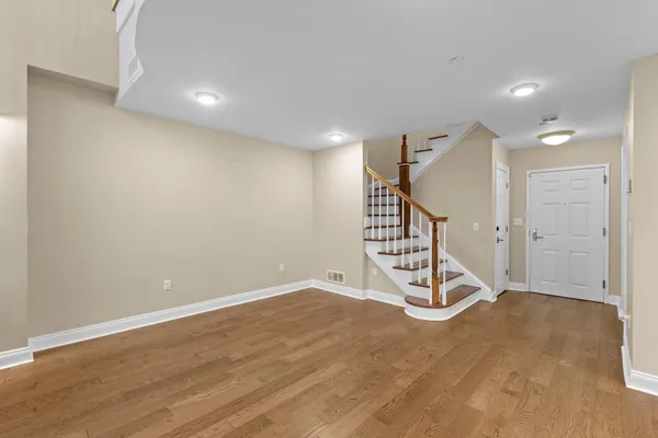 a view of an empty room with stairs