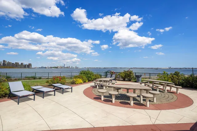 a view of a swimming pool with lounge chair