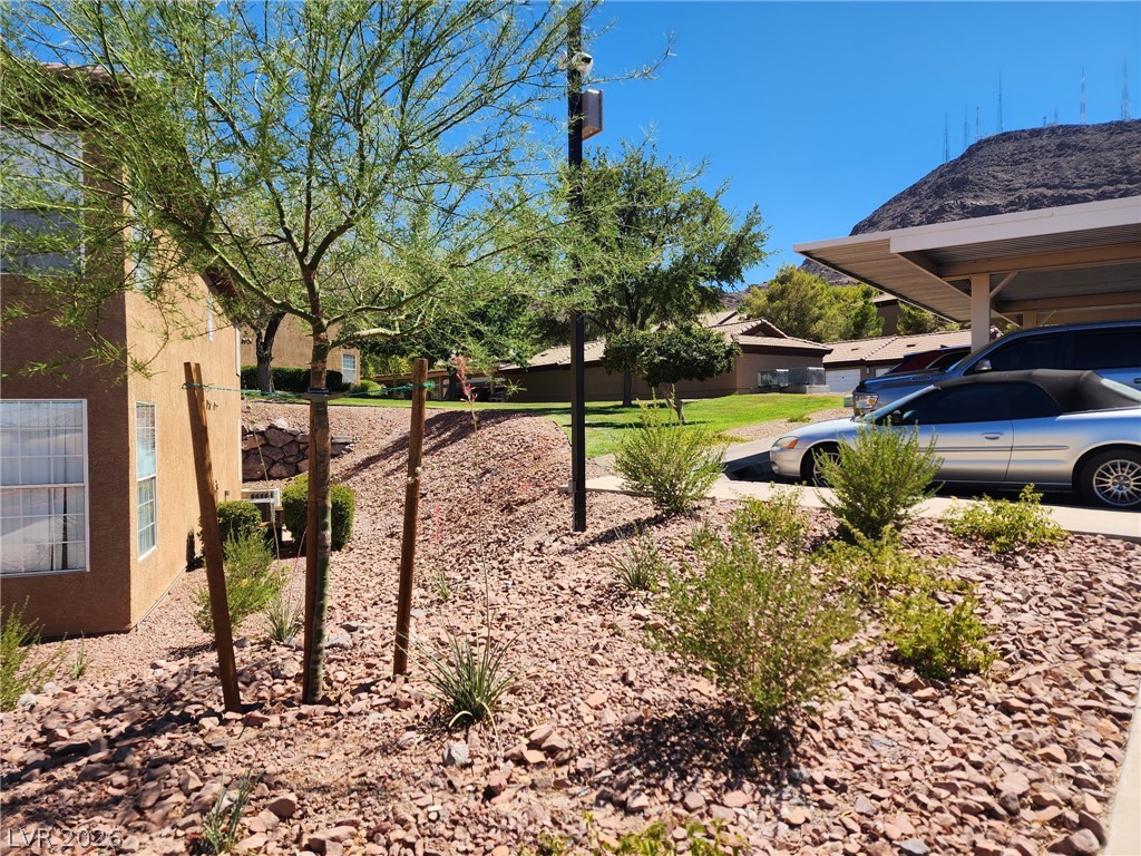 231 West Horizon Ridge Parkway, Unit 1127 Henderson, NV 89012 - Photo 38 of 39 A desert landscape with varied greenery and covered parking complements this property's setting.