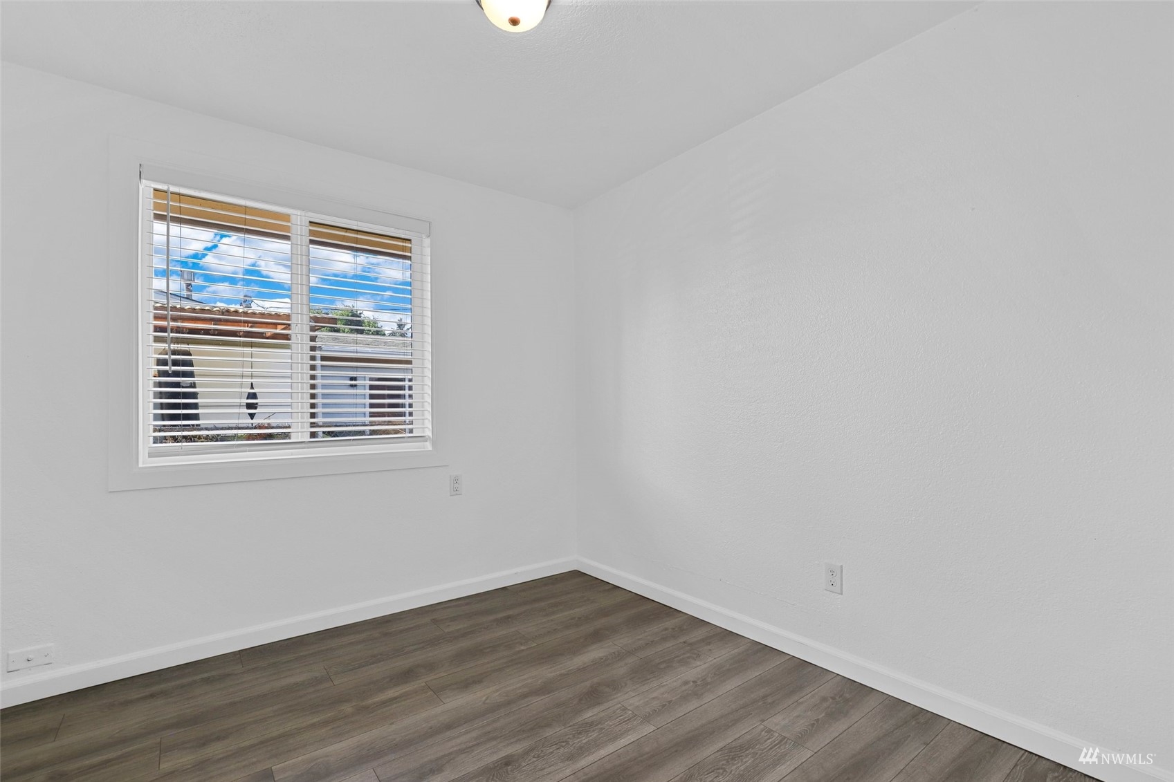25 Rips Lane Southwest Lakewood, WA 98499 - Photo 23 of 33 wooden floor in an empty room with a window