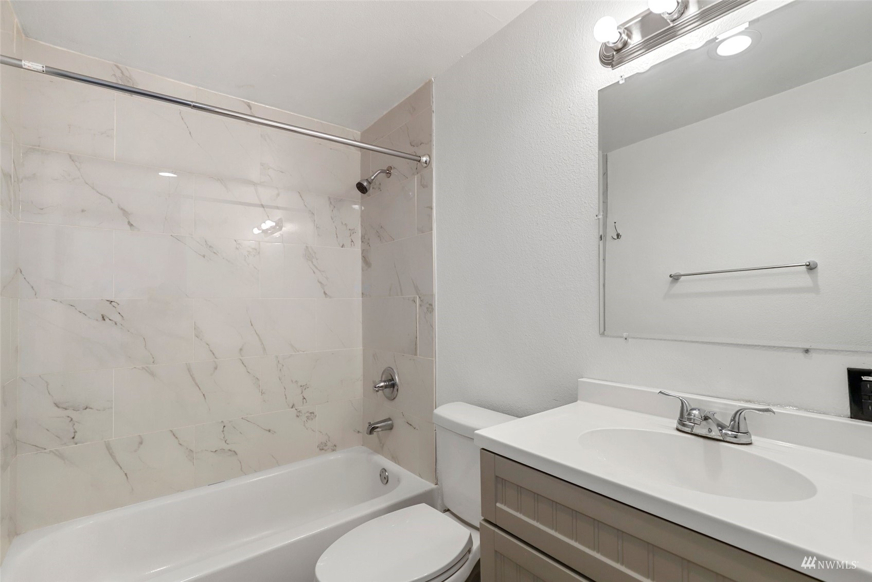 25 Rips Lane Southwest Lakewood, WA 98499 - Photo 25 of 33 a bathroom with a sink toilet vanity and shower