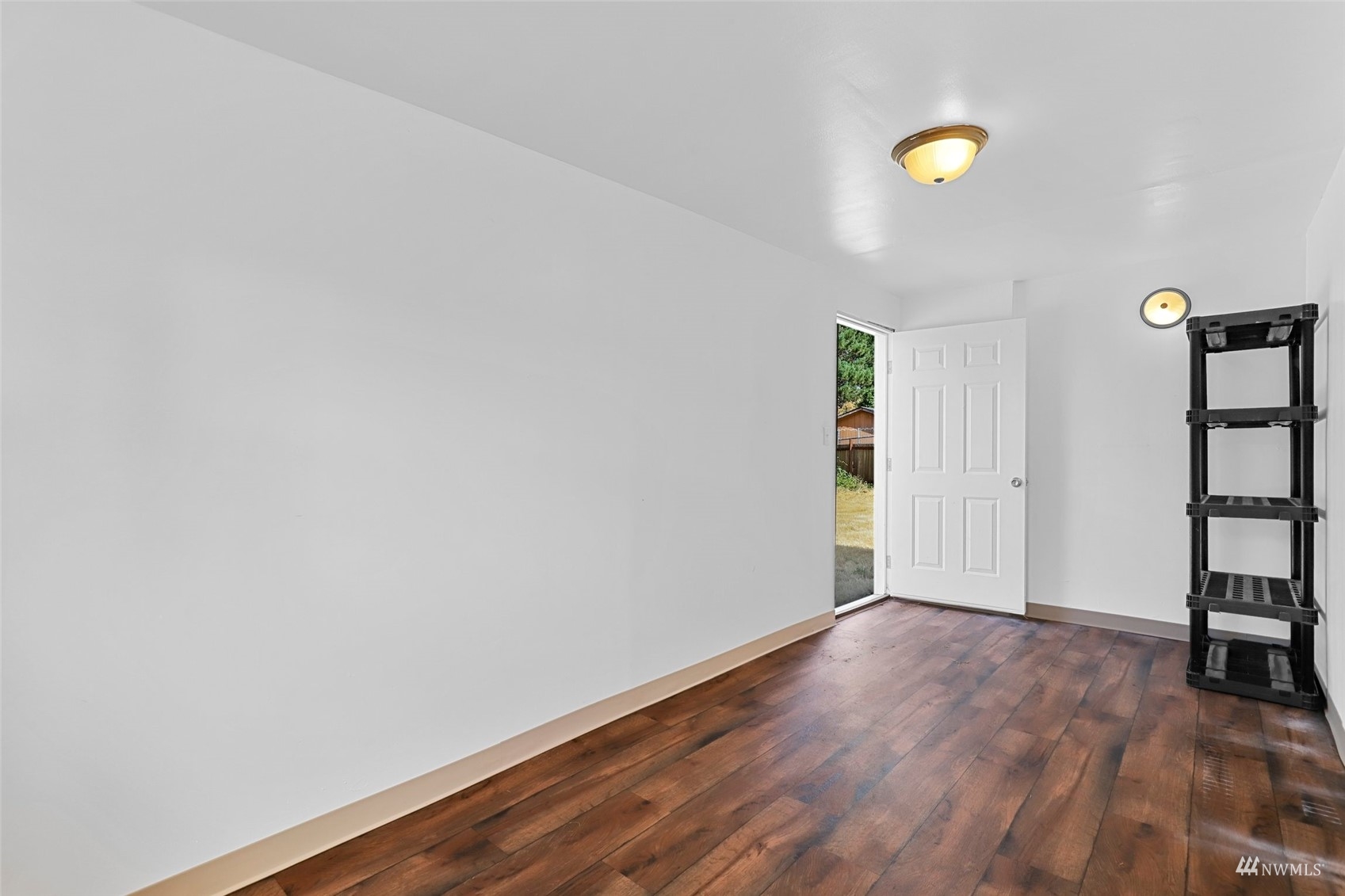 25 Rips Lane Southwest Lakewood, WA 98499 - Photo 29 of 33 a view of an empty room with wooden floor and window