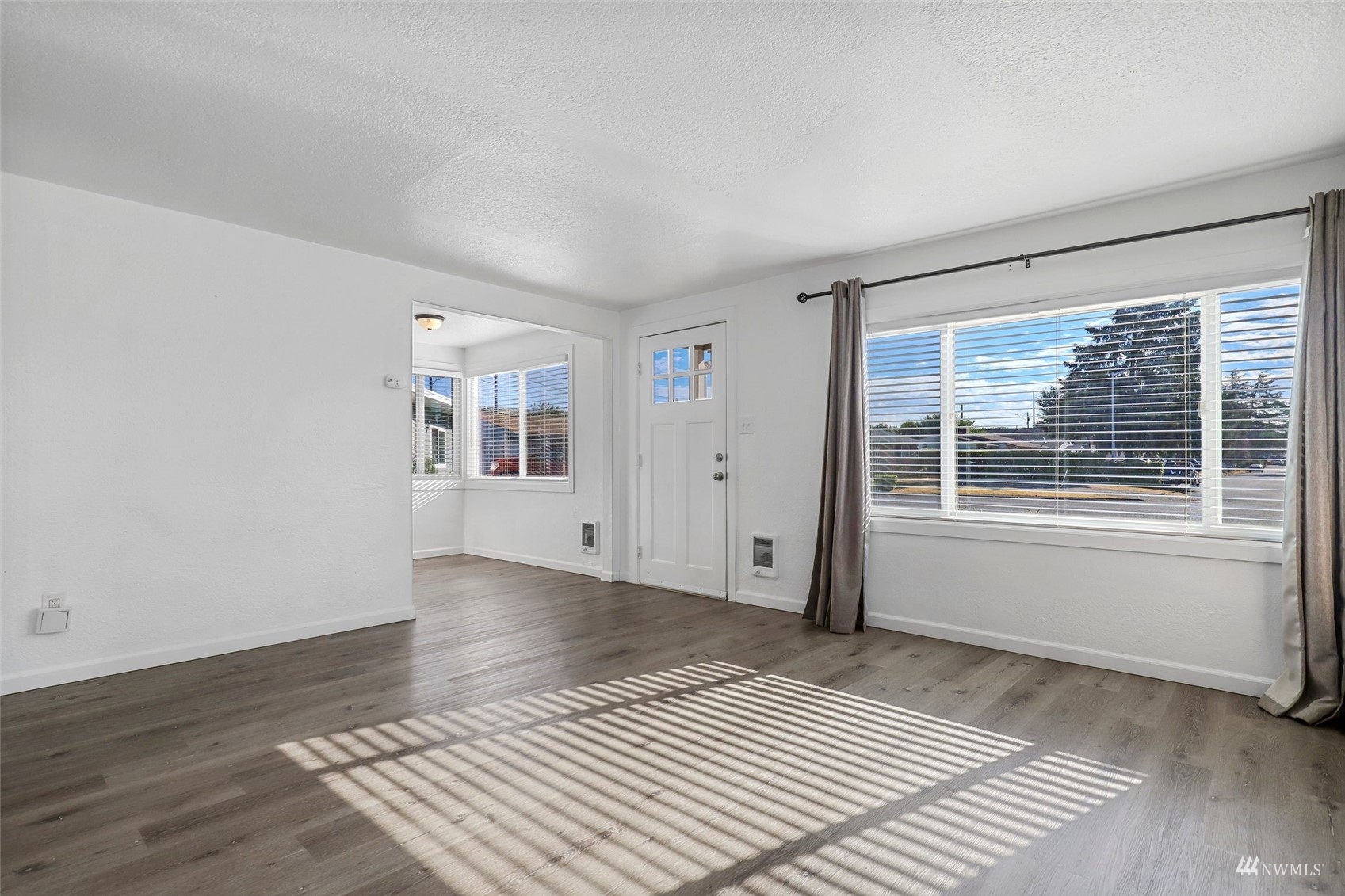 25 Rips Lane Southwest Lakewood, WA 98499 - Photo 7 of 33 a view of wooden floor and windows in a room