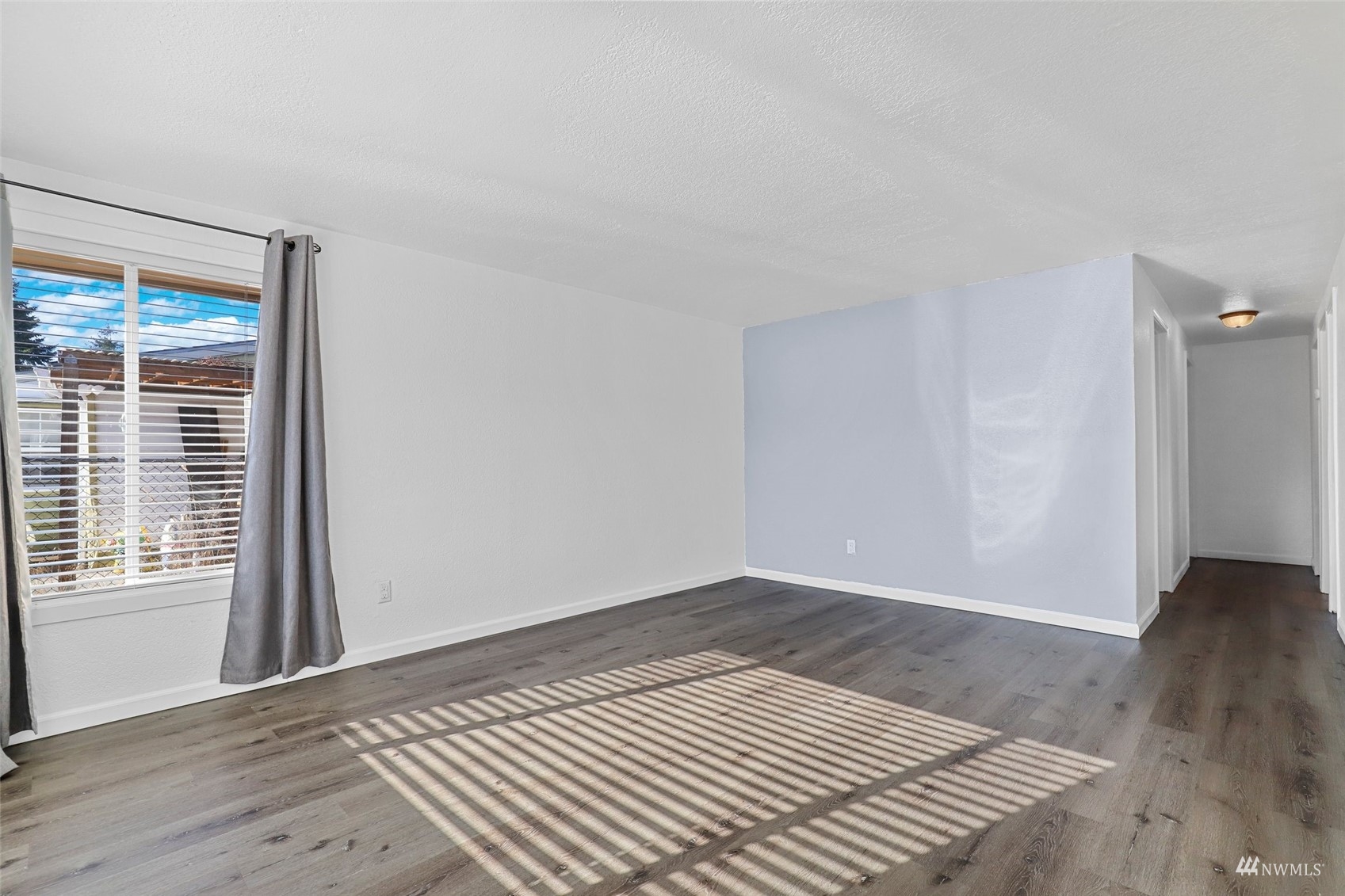 25 Rips Lane Southwest Lakewood, WA 98499 - Photo 8 of 33 a view of a room with wooden floor and a window