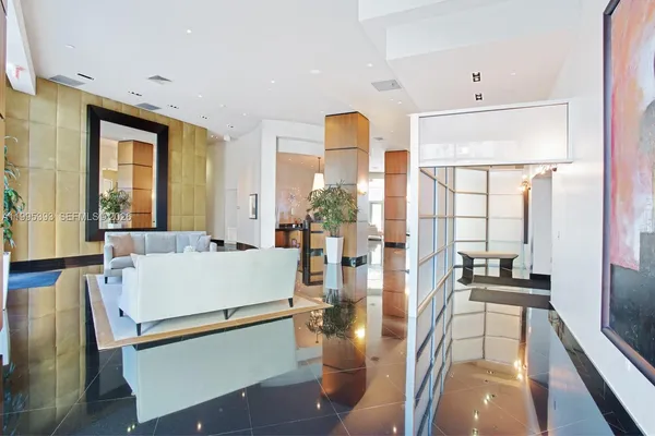 a large white kitchen with a large window