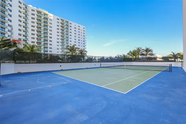 a view of an outdoor space and tennis court