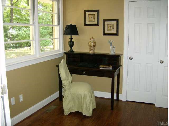 512 Chamberlain Street Raleigh, NC 27607 - Photo 11 of 11 a view of a workspace room with wooden floor and windows