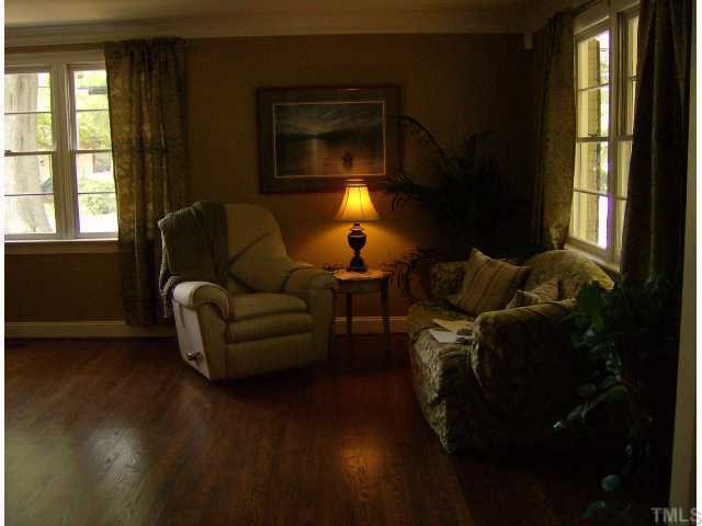 512 Chamberlain Street Raleigh, NC 27607 - Photo 2 of 11 a living room with furniture and a lamp