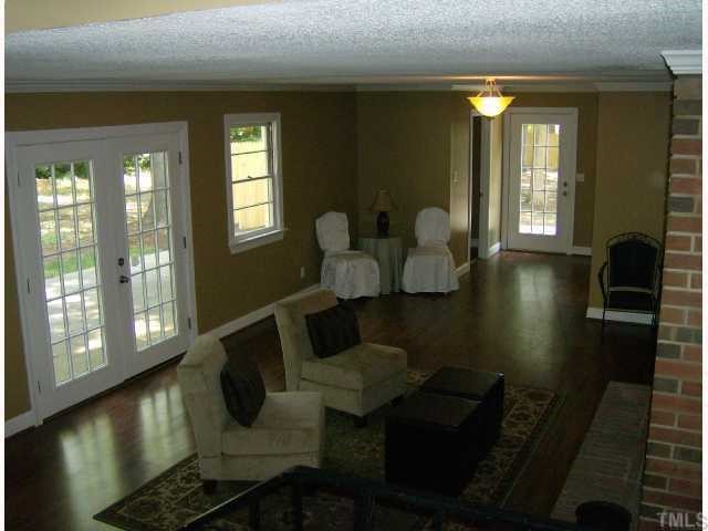 512 Chamberlain Street Raleigh, NC 27607 - Photo 6 of 11 a living room with furniture and a large window