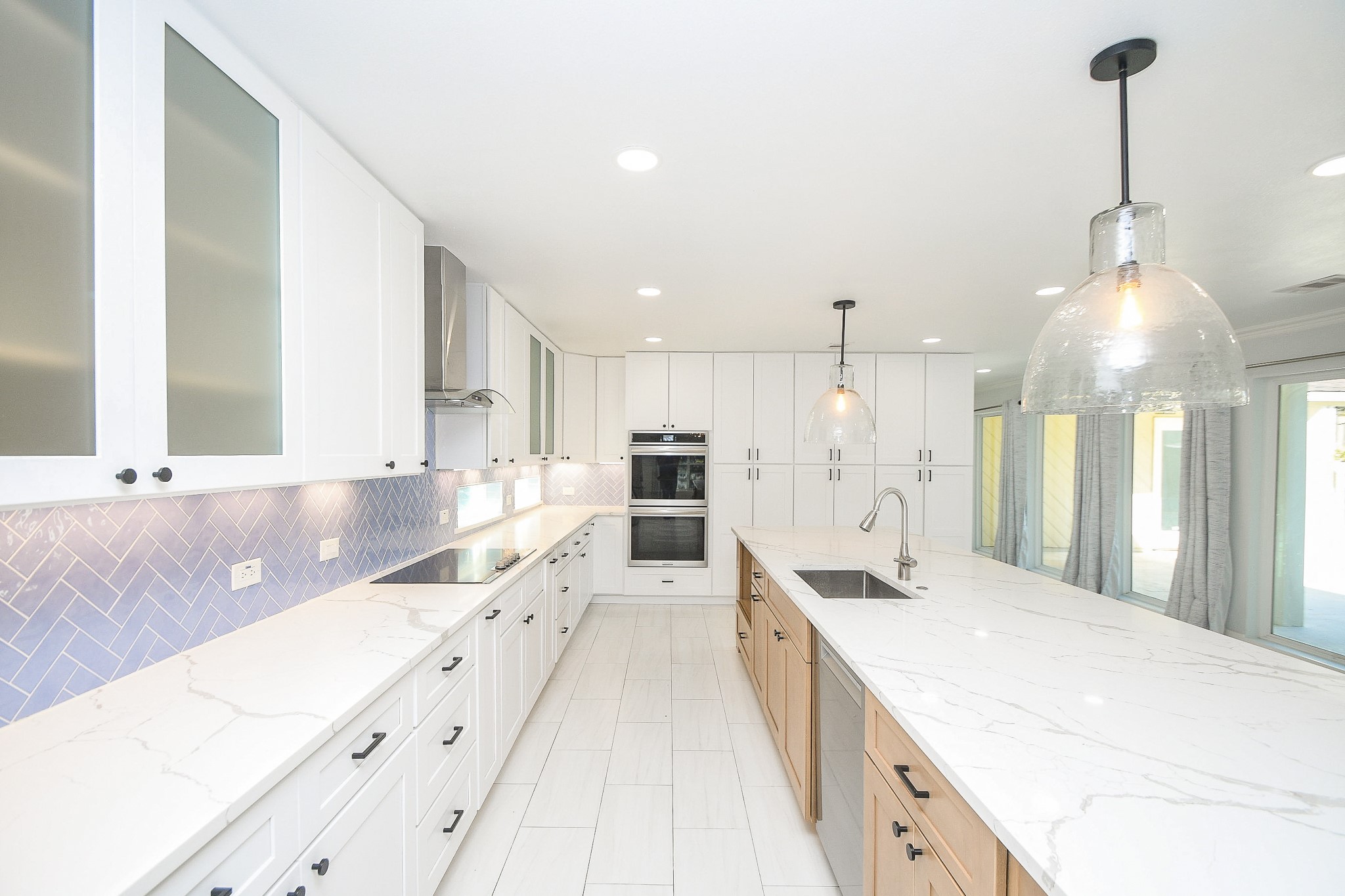 7902 Duffield Lane Houston, TX 77071 - Photo 11 of 31 a large white kitchen with a large window