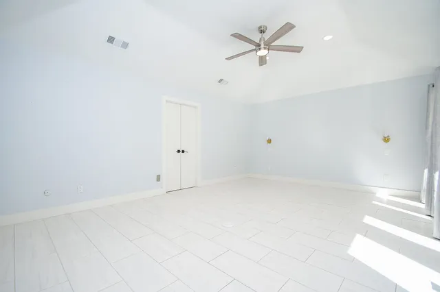 a bathroom with a tub sink and shower