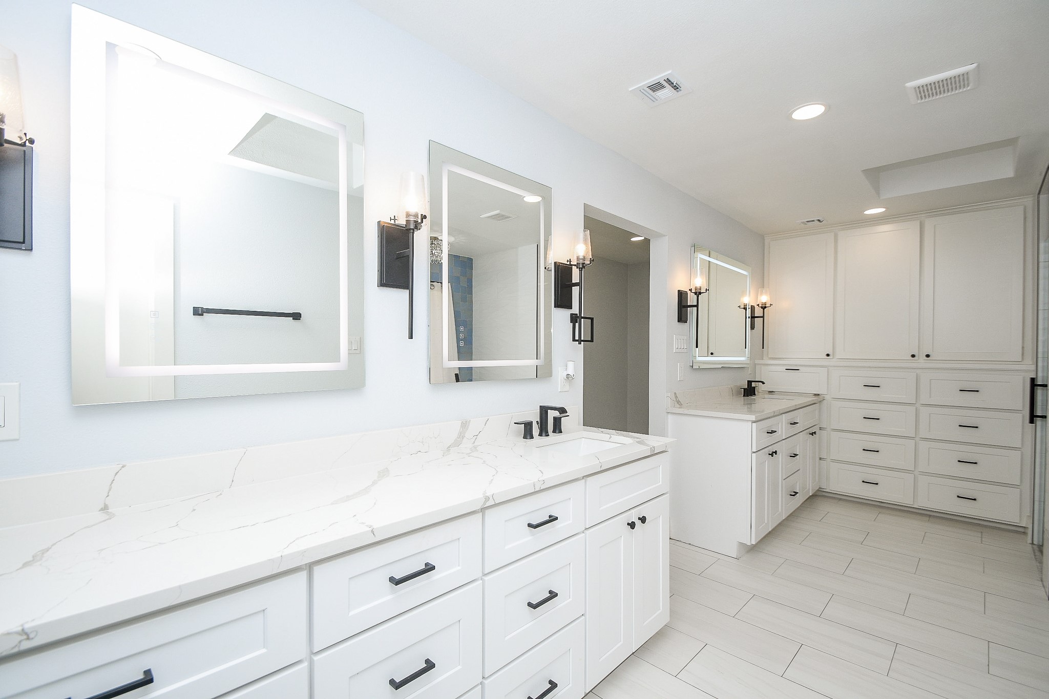 7902 Duffield Lane Houston, TX 77071 - Photo 15 of 31 a bathroom with a double vanity sink a mirror and a