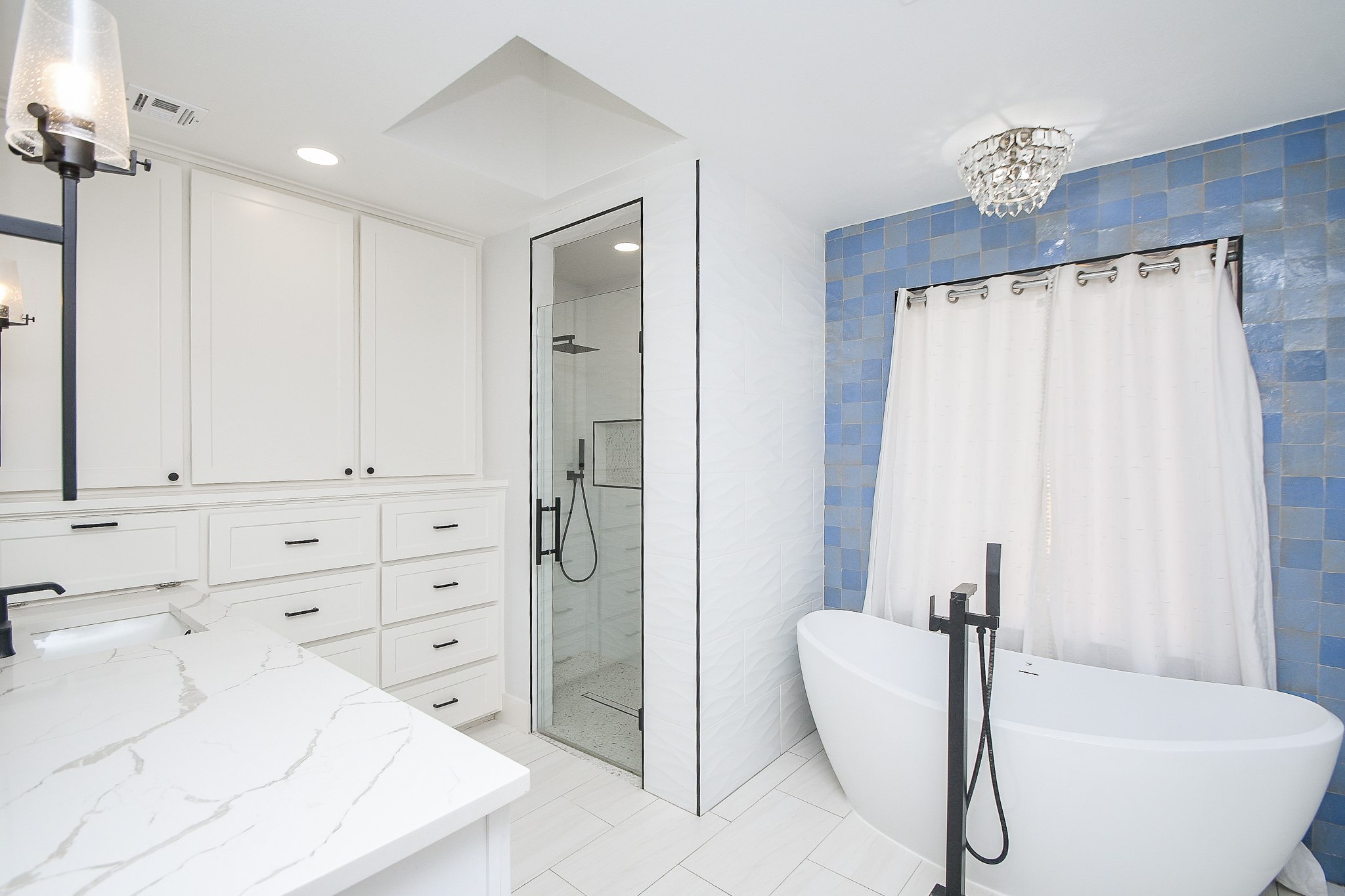 7902 Duffield Lane Houston, TX 77071 - Photo 16 of 31 a bathroom with a tub shower and sink