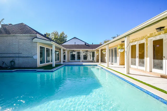 a view of a house with swimming pool