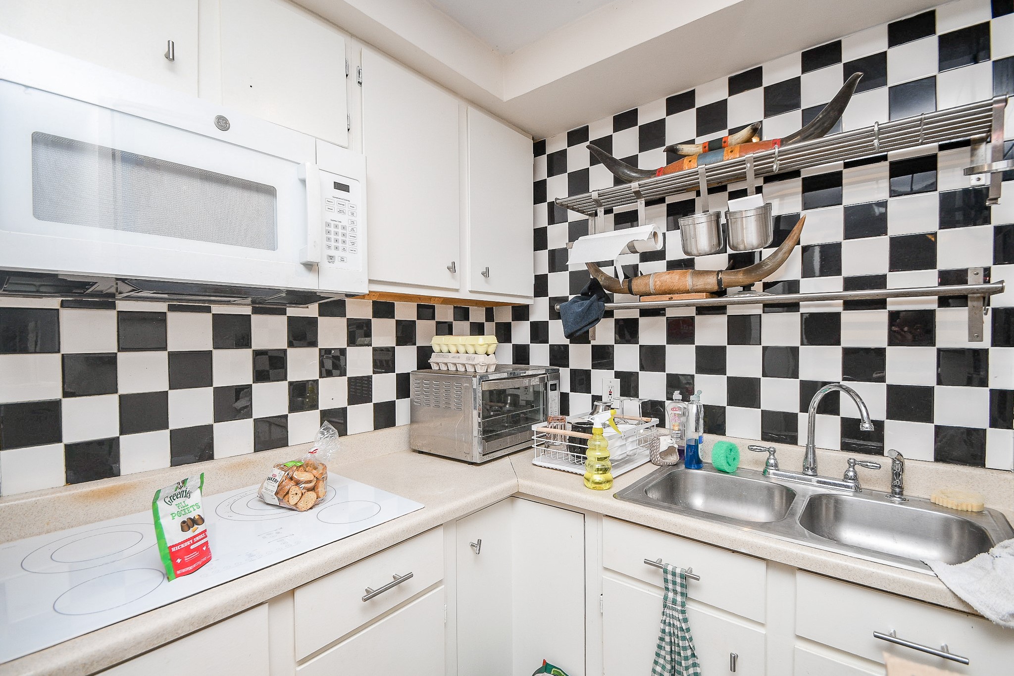 7902 Duffield Lane Houston, TX 77071 - Photo 28 of 31 a kitchen with a sink and a white cabinets