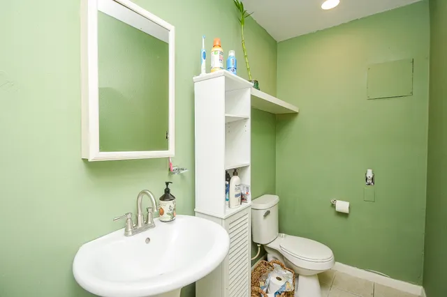 front view of a house with potted plants