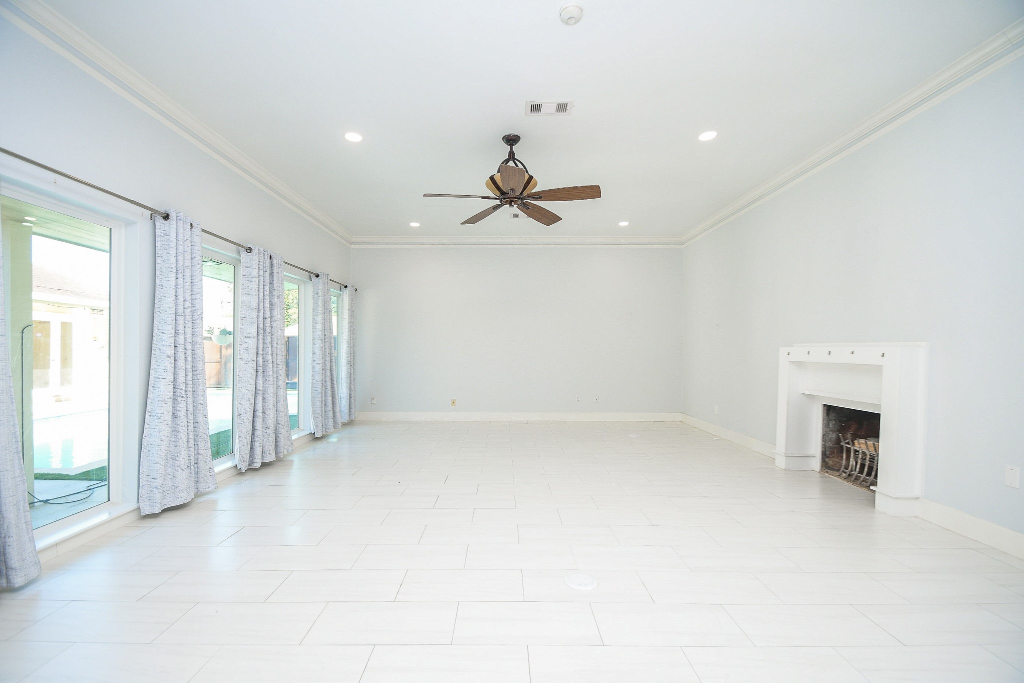 7902 Duffield Lane Houston, TX 77071 - Photo 4 of 31 wooden floor in an empty room with a fireplace