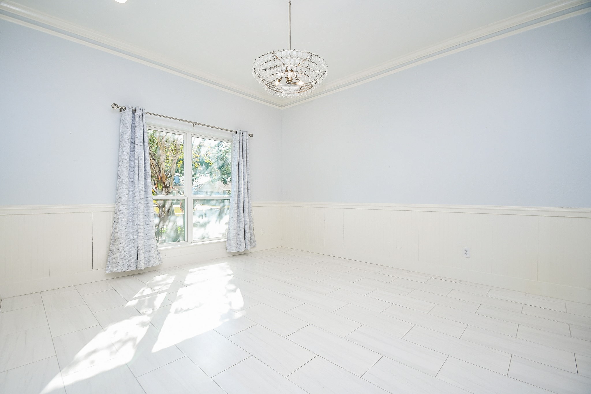 7902 Duffield Lane Houston, TX 77071 - Photo 8 of 31 a view of a big room with windows and chandelier fan