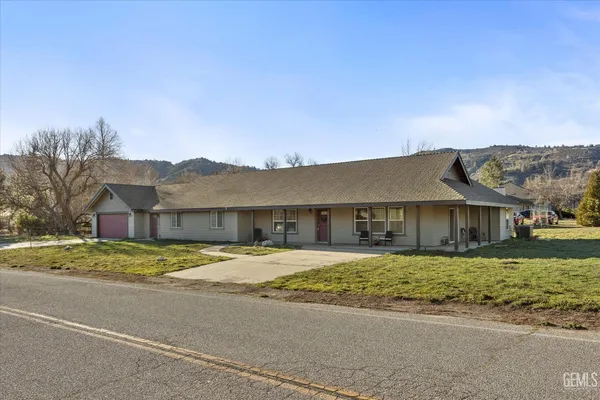 a view of a kitchen with furniture and a kitchen