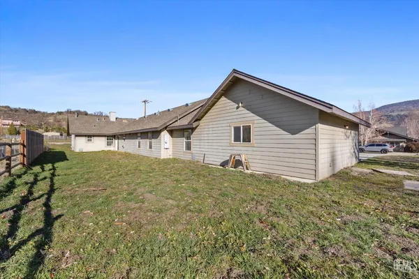 a view of a house with a yard