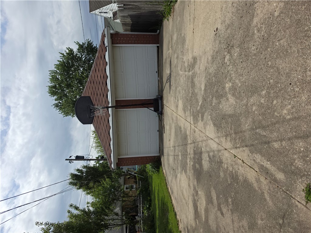 3109 Shroyer Road Kettering, OH 45429 - Photo 19 of 25 This garage offers convenient parking and easy access, complemented by a sturdy concrete driveway.
